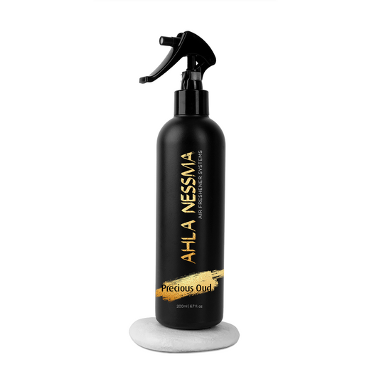 fabric spray bottle with 'AHLA NESSIMA' branding for home carpets or sofas